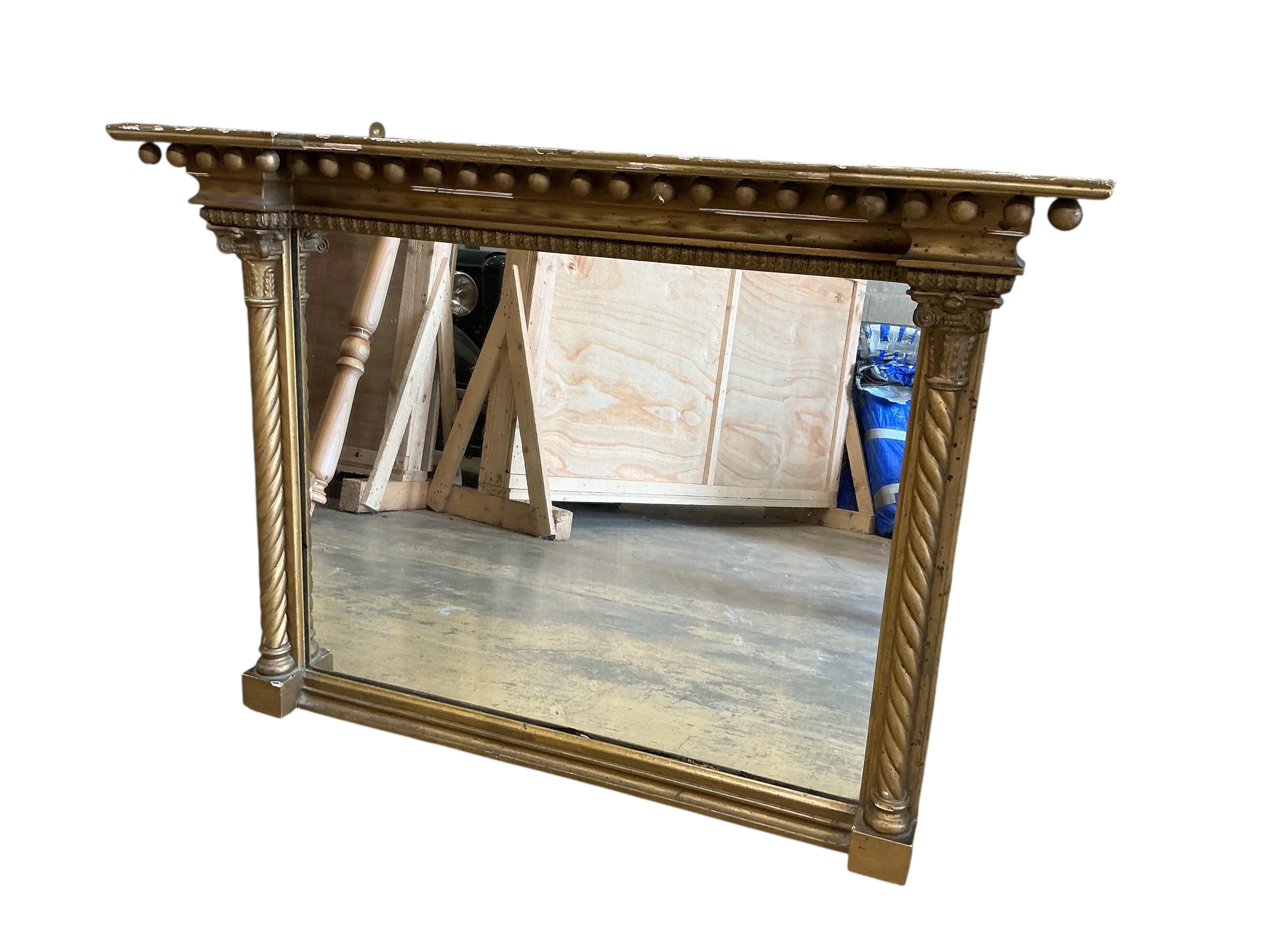 A Regency giltwood and composition overmantel mirror, width 104cm, height 74cm